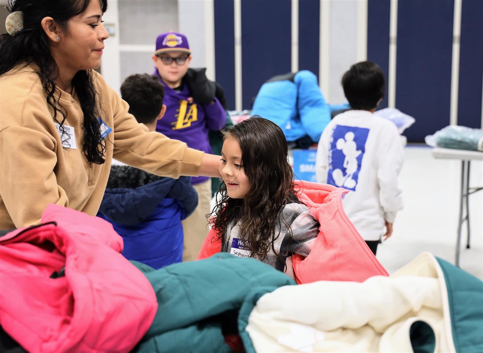 valencia park student trying on a coat